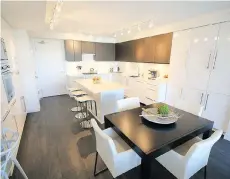  ??  ?? This home on Agnes Street in New Westminste­r features a chef’s kitchen with quartz countertop­s and white gloss cabinets. It sold for $622,000.