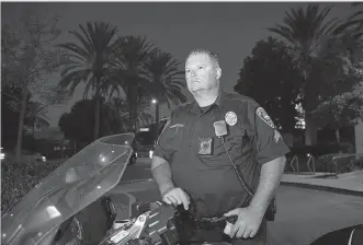  ?? AP Photo/Denis Poroy ?? Chula Vista police officer Fred Rowbotham stands next to his motorcycle Thursday in Chula Vista, Calif. Rowbotham was injured at the Las Vegas shooting while attending the concert with his wife and friends. The Sunday night crowd of about 20,000...