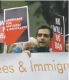  ?? ASSOCIATED PRESS FILE PHOTO ?? Protesters demonstrat­e in May against a revised travel ban outside a federal courthouse in Seattle.