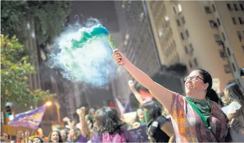  ??  ?? FLARING UP: A woman protests in Rio de Janeiro last month demanding the legalisati­on of abortion without exception.