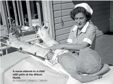  ?? ALEXANDER TURNBULL LIBRARY ?? A nurse attends to a child with polio at the Wilson Home.