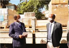  ?? Pictures: John Manzongo ?? Health and Child Care Minister Dr Obadiah Moyo engages World Health Organisati­on country representa­tive Dr Alex Gasasira during the handover of personal protective equipment in Harare yesterday.