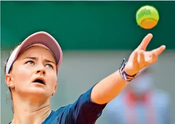  ?? — AFP ?? Czech Republic’s Barbora Krejcikova serves to Ukraine’s Elina Svitolina during their third round match of the French Open at Roland Garros in Paris on Saturday. Krejcikova won 6-3, 6-2.