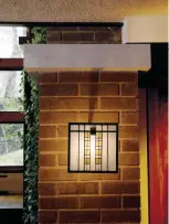  ??  ?? LEFT Art-glass light screens are patterned after originals in the addition to a 1914 house by John Van Bergen. Note the concrete slab “capitals” on piers of brick with raked joints.