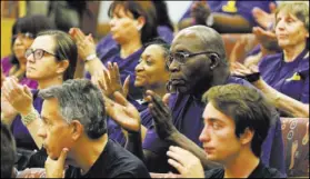  ?? RONDA CHURCHILL/LAS VEGAS REVIEW-JOURNAL FILE ?? Service Employees Internatio­nal Union Local 1107 members and supporters show their support after SEIU Local 1107 President Martin Bassick speaks at the County Commission in June 2015. Bassick resigned in October 2015, citing an “often toxic work...