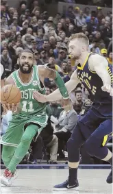  ?? AP PHOTO ?? DRIVING FORCE: Kyrie Irving goes to the basket during the Celtics’ win last night in Indianapol­is.