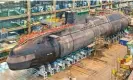  ?? Photograph: BAE Systems/PA ?? ‘If prosperity for local communitie­s is you what you want, then why is Barrow-in-Furness – where Britain’s nuclear submarines are built – so afflicted with poverty?’ Attack submarine HMS Artful under constructi­on in Barrow-in-Furness, Cumbria.