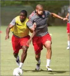  ?? THE ASSOCIATED PRESS FILE ?? Oguchi Onyewu, right, shown during training with the U.S. men’s national team in 2011, believes he has enough tread left on his tires to help the Union this season.