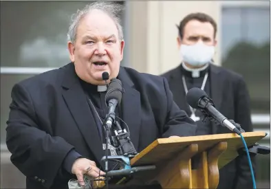  ?? Carlos Gonzalez / Associated Press ?? Archbishop Bernard Hebda speaks during a news conference at Archdioces­an Catholic Center in St. Paul, Minn., on May 21, amid the coronaviru­s pandemic. The St. Paul Cathedral is only open for confession­s at this time.