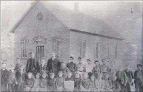  ?? COURTESY PHOTO ?? Farmington’s first brick building built in 1891. This photo is dated around 1900. The first brick school was built on the current campus of Farmington High School.