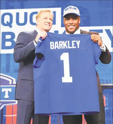  ?? Tom Pennington / Getty Images ?? Saquon Barkley, right, with NFL Commission­er Roger Goodell after being selected No. 2 overall by the New York Giants during the first round of the NFL draft at AT&T Stadium on Thursday.