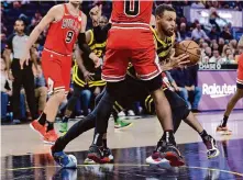  ?? Carlos Avila Gonzalez/The Chronicle ?? Stephen Curry sprained his right ankle Thursday against the Bulls, but an MRI revealed no further structural damage.