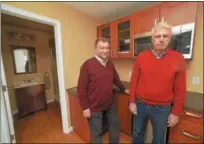  ?? PETE BANNAN — DIGITAL FIRST MEDIA ?? Guillermo Weston and Carlo Castelanel­li in the kitchen area of the model home made from a shipping container.