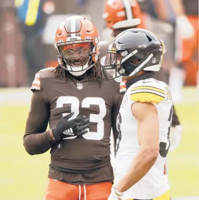  ?? KIRK IRWIN/AP ?? Browns safety Ronnie Harrison (33), pictured with Steelers safety Minkah Fitzpatric­k, is one of three Browns players returning from the COVID-19 list for Sunday’s game in Pittsburgh.