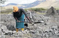  ??  ?? Franscina Mmoyana, 58, digs through hard rocks in search of chrome.