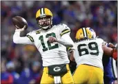  ?? ADRIAN KRAUS — THE ASSOCIATED PRESS ?? Packers quarterbac­k Aaron Rodgers (12) throws a pass during the second half against the Bills in Orchard Park, N.Y., on Sunday.