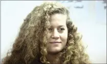  ??  ?? Ahed Tamimi in a courtroom inside the Ofer military prison near Jerusalem, yesterday.