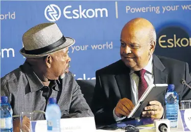  ?? Picture: MASI LOSI ?? BRINGING LIGHT: Eskom board chair Jabu Mabuza, left, talks to public enterprise­s minister Pravin Gordhan before the media briefing about the power outages that have hit the country