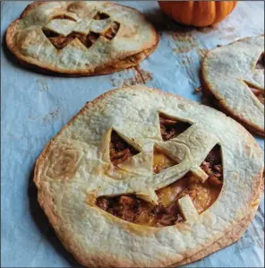  ??  ?? Stuffed with chicken and cheese, Jack-O’-Lantern Quesadilla­s make a quick and easy dinner on Halloween.