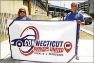  ?? Ned Gerard / Hearst Connecticu­t Media ?? Jesenia Rodriguez and Carlos Gomez of Connecticu­t Drivers United pose in Bridgeport, May 26.