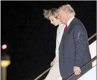  ?? AP/CAROLYN KASTER ?? President Donald Trump departs Air Force One with his son, Barron, as they arrive Friday night at the airport in West Palm Beach, Fla., for the weekend. Trump later took to Twitter to rail against what he called the “Russian Witch Hunt.”