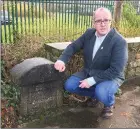  ??  ?? Cllr. Chris MacManus at one of the Boundary Stones located at Finisklin.