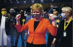  ?? JANE BARLOW — PA MEDIA VIA THE ASSOCIATED PRESS ?? First Minister and SNP party leader Nicola Sturgeon celebrates after retaining her seat for Glasgow Southside at the count for the Scottish Parliament­ary Elections in Glasgow, Scotland, on Friday.