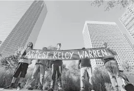  ?? LM Otero / Associated Press ?? Demonstrat­ors call for the arrest of Energy Transfer Partners CEO Kelcy Warren last week during a protest outside the federal building housing the Army Corps of Engineers offices in Dallas.