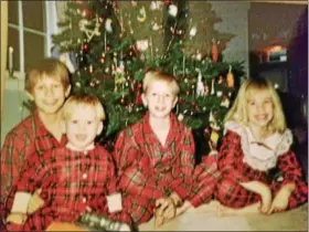  ?? PHOTO COURTESY OF KATHY OSEBOLD ?? Matching pajamas for kids on Christmas is not exactly a new trend. Kathy Osebold dressed her children, pictured here in this photo from 1988, in matching Christmas pajamas.