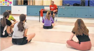  ?? MICHAEL ROBAR • THE GUARDIAN ?? Liberal MLA Gord McNeilly talks to students at Birchwood Intermedia­te School in Charlottet­own about Black History Month on Friday