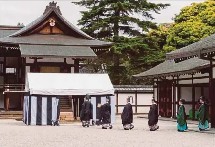  ?? AFP PIC ?? An imperial turtle-shell divination rite held at the Imperial Palace in Tokyo yesterday.