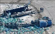  ??  ?? Emergency personnel work at the scene of a crash outside of Tisdale, Saskatchew­an, Canada, on April 7. Sixteen people aboard the bus carrying a junior hockey team were killed.