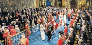  ??  ?? ● Queen Elizabeth and Prince Charles, Prince of Wales proceed through the Royal Gallery before the Queen’s speech during the State Opening of Parliament