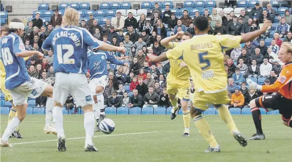  ?? ?? George Boyd (headand) opens the scoring for Posh in a 2-0 League One win over Leeds United in October, 2008.