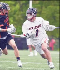  ?? Dave Stewart / Hearst Connecticu­t Media ?? New Canaan’s Hayden Shin (7) comes up with the ball during a faceoff, while Ridgefield’s Terry Li pursues at Dunning Field in New Canaan on Saturday.