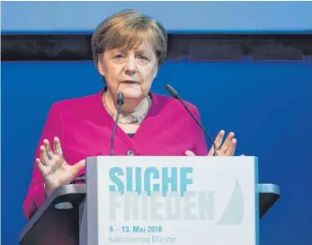  ?? FOTO: DPA ?? „Wenn wir keine gemeinsame internatio­nale Ordnung erreichen, sondern jeder macht, was er will, dann ist das eine schlechte Nachricht für die Welt“, sagt Kanzlerin Angela Merkel beim Katholiken­tag in Münster.