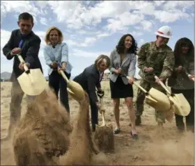  ?? SUSAN MONTOYA BRYAN — THE ASSOCIATED PRESS ?? Democratic U.S. Sen. Martin Heinrich of New Mexico, from left, U.S. Energy Under Secretary for Nuclear Security Lisa Gordon-Hagerty, Democratic Rep. Michelle Lujan Grisham and other officials break ground for a new multimilli­on-dollar office building...