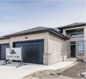  ??  ?? D&amp;S Homes’ latest show home is located at 959 Stony Cres. in Martensvil­le and features a large bi-level design and a coveted three-car garage to store all the toys.