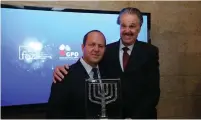  ?? (Courtesy) ?? JERUSALEM MAYOR Nir Barkat receives the ‘Friends of Zion’ Award from Dr. Mike Evans.