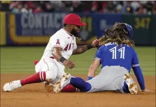  ?? MARK J. TERRILL – THE ASSOCIATED PRESS ?? Luis Rengifo of the Angels tags out the Blue Jays' Bo Bichette, who tried to steal second in a May 26game.