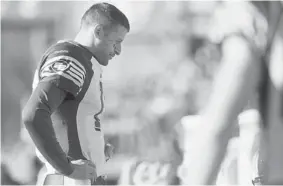  ?? LIAM RICHARDS/The Canadian Press ?? Edmonton Eskimos quarterbac­k Mike Reilly has taken a lot of punishment this season,
including a concussion suffered at the hands of the Toronto Argonauts.