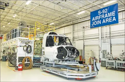  ?? MEDIANEWS GROUP FILE PHOTO ?? A group of Chester County leaders met with Sikorsky representa­tives at the company’s Sadsbury facility July 15 to discuss the future of the plant. This file photo shows an S-92A helicopter in the process of being built at the Sikorsky plant.