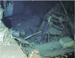  ?? PAUL G. ALLEN VIA AP ?? Images from a remotely operated underwater vehicle show wreckage of the USS Indianapol­is, including the ship’s bell, right photo, at the bottom of the North Pacific Ocean. The ship played a key role in the bombing of Hiroshima.