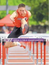  ?? JIM THOMPSON/JOURNAL ?? LEFT: Ortiz clears the last hurdle for the win in the prelims in the Boys 4A State Track Meet at UNM Track in May.
FAR LEFT: Ortiz was an across-theboard threat in basketball, scoring 21 points a game, with 7.9 rebounds, 3.9 assists and 2.1 steals and...