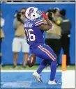  ?? PAUL SANCYA — THE ASSOCIATED PRESS ?? Buffalo Bills running back Devin Singletary (26) signals to the crowd after his 5-yard rushing touchdown during the second half of Sunday’s game against the Cleveland Browns in Detroit.