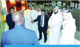  ??  ?? Minister of Health Sheikh Basel Al-Sabah tours a gallery held as part of the forum.