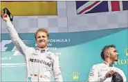  ?? REUTERS PHOTO ?? Despite his win in Belgium, Nico Rosberg (left) still trails Lewis Hamilton (right) by nine points in the championsh­ip.