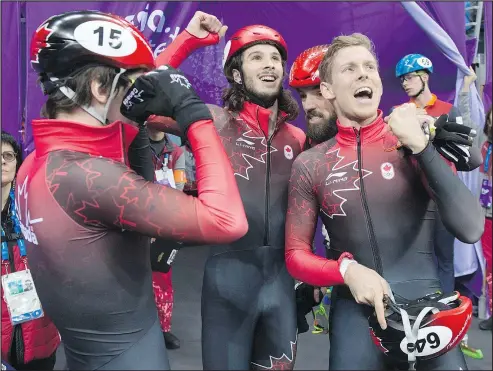  ?? THE CANADIAN PRESS ?? The Canadian men’s team reacts after qualifying in the 5,000-metre short-track speed skating relay on Tuesday.