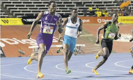  ?? (Photo: Naphtali Junior) ?? Action from a Boys’ 200m semi-final event at the Issa/gracekenne­dy Boys’ and Girls’ Championsh­ips at the National Stadium on Friday night.