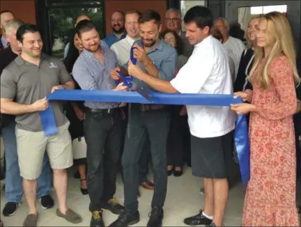  ?? BOB KEELER — DIGITAL FIRST MEDIA ?? Northbound owners, from left, Marat Mamedov, Gerard Angelini, Cody Ferdinand, Jeff Sacco and Christina Conchado, prepare to cut the ribbon Aug. 31 for the new restaurant in the former Souderton train station.